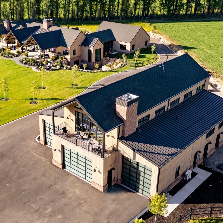 aerial view of large home and roof